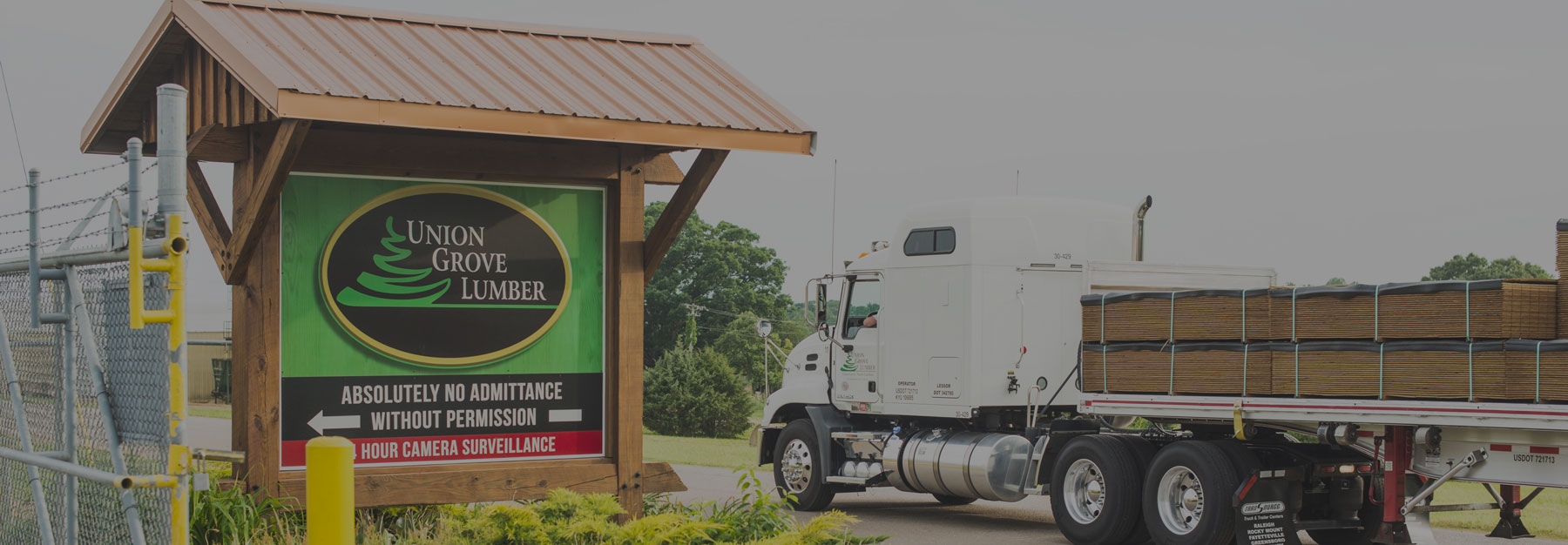 Union Grove Lumber Sign and Truck Carrying Barn Lumber